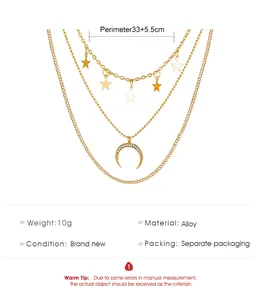 Close-up of gold three-layer necklace with crescent moon and star charms in high detail
