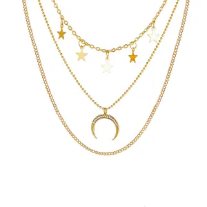 Three-layer gold necklace featuring star pendants and a crescent moon with pavé diamonds