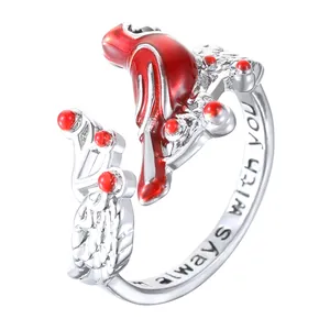 Detail of red cardinal bird ring showing the engraved phrase I am always with you