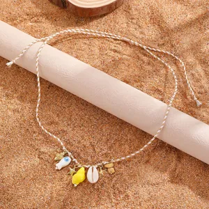 Collana bohémien multistrato con tartaruga marina, stelle marine e perline turchesi