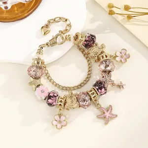 Bracelet à breloques dorées avec cristaux roses, pendentifs étoile de mer et tortue
