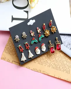 Detailed set of nine Christmas stud earrings with Santa, tree and snowflake designs