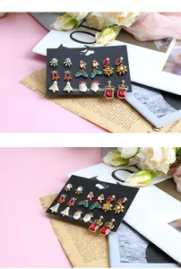 Detail view of 6 pairs of festive Christmas stud earrings with snowflake and reindeer motifs
