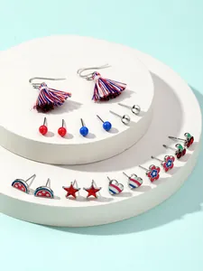 Detailed view of patriotic earring set featuring red white blue tassels and stars