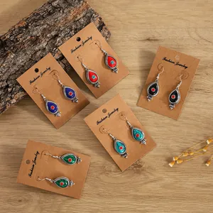 Detailed set of bohemian teardrop earrings in five colors with card packaging