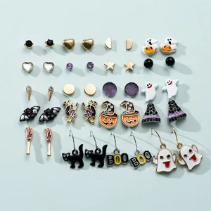 Set of 15 pairs of Halloween stud earrings with ghosts, pumpkins, and bats on blue background