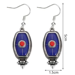 Detail view of retro silver earrings with turquoise inlay and 5cm height dimensions