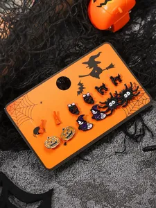 Close-up of 6 pairs Halloween earrings with pumpkin, skull, and spider motifs on card