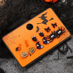 Spooky Halloween stud earring set featuring pumpkin skull and spider on orange card