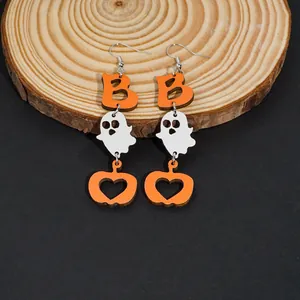 Halloween dangle earrings with orange letters, white ghosts, and carved pumpkin charms
