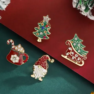 Charming 4-piece Christmas brooch set with rhinestone Xmas tree, sled, and gift bag