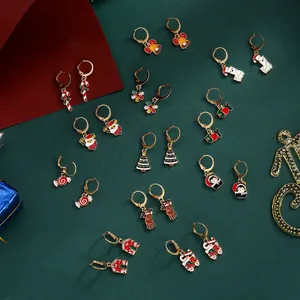 12 pairs of Christmas hoop earrings set featuring festive charms like reindeer and trees