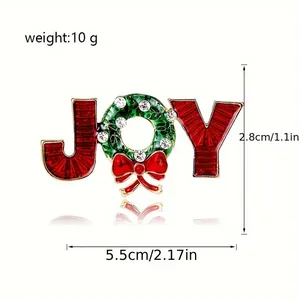 Détails de la broche de Noël JOY avec émail rouge et couronne de strass brillants