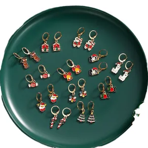 12-pair Christmas earring set with reindeer, snowflake and Santa motifs on gold metal