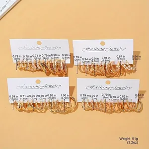 Detail view of 24-piece vintage gold earring set with dimensions and pearl accents