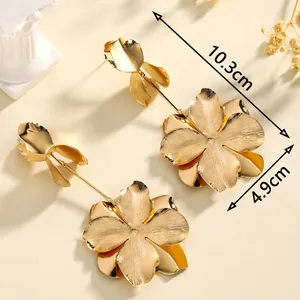 Elegant gold flower tassel drop earrings with brushed metal petals and 10.3cm length