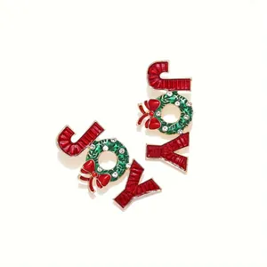 Boucles d'oreilles de Noël JOY avec lettres rouges et couronne verte à nœud
