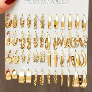 Detailed set of 24 pairs gold-tone earrings with pearls, crystals and geometric shapes