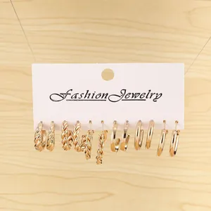 Detail view of 6 pairs vintage gold hoop earrings with twist and braided textures on card