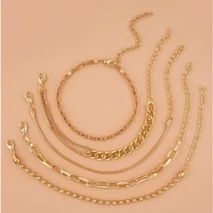 Five-piece gold Bohemian bracelet set with Cuban, snake, and paperclip link chains