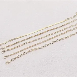 Detailed close-up of 5-piece gold-toned bohemian chain set with lobster clasps