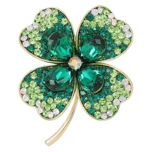 Exquisite gold-plated four-leaf clover brooch with green crystals and sparkling rhinestones