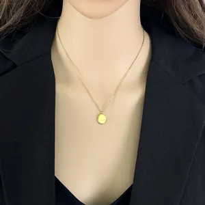 Minimalist gold titanium steel necklace with engraved 'just breathe' coin pendant