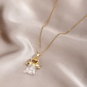 Luxurious gold angel necklace with large water drop crystal on champagne silk