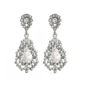 Detailed view of silver teardrop tassel earrings with sparkling pear-cut crystals