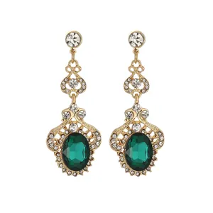 Vintage gold-plated drop earrings with large green gemstone and white rhinestones
