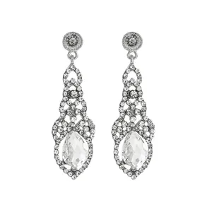 Close-up of vintage silver drop earrings with marquise crystals and pear-shaped stone