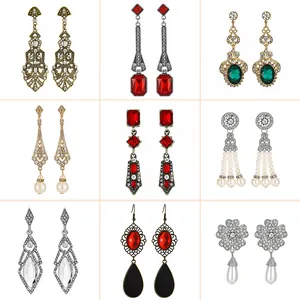 Vintage bohemian drop earrings set with crystals and tassels in gold and silver finish