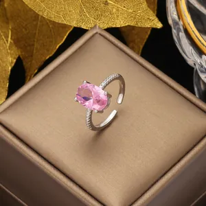 Luxury vintage adjustable ring with pink oval gemstone and sparkling white zircon accents