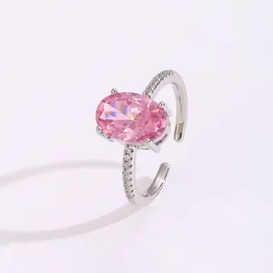 Detail of pink oval gemstone ring with pavé diamonds and silver adjustable band