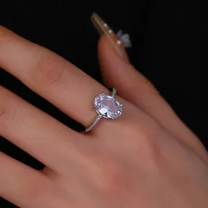 Detailed close-up of a silver ring featuring a large oval zircon and pavé setting stones