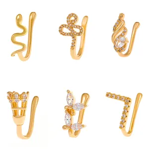 Set di 6 finti piercing al naso dorati con zirconi in forme di serpente e farfalla