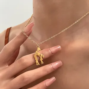 Golden mother-daughter pendant necklace on model highlighting vintage aesthetic