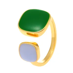 Minimalist gold open ring featuring square green and light purple enamel stones