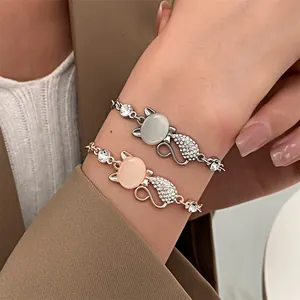Detailed view of cat-shaped cat's eye stone bracelets with sparkling rhinestones in silver and rose gold