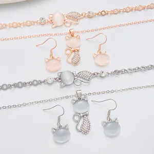 Detailed set of cat-shaped opal necklaces, bracelets, and earrings in rose gold and silver