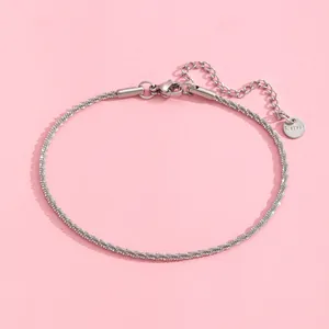 Detailed macro view of the silver stainless steel chain with lobster clasp and extension