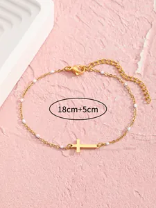Detailansicht von 18cm plus 5cm Goldkreuz Armband mit weißen Perlen und Karabiner