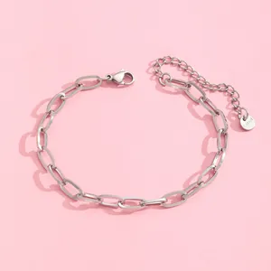 Detail of silver stainless steel paperclip chain bracelet with lobster clasp and extender