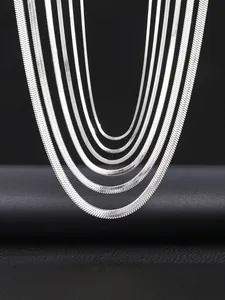 Detail of silver stainless steel snake chains in multiple widths with high polished shine
