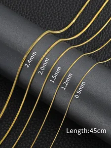 Detail showing various diameters of 18K gold snake chains from 0.9mm to 2.4mm