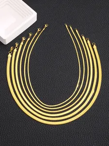 Flat snake bone chain collection in various widths with lobster clasp on black leather