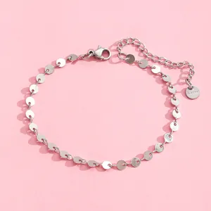 Detailed macro view of stainless steel chain bracelet with lobster clasp and extension chain