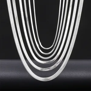 Flat silver snake bone chain necklaces in various widths on a dark textured background