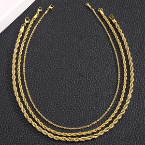 Golden stainless steel rope chains in four different widths on a black leather background