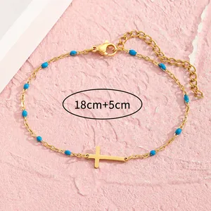 Goldenes Edelstahlarmband mit Kreuz und königsblauen Perlen und verstellbarer 5cm Kette